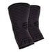 A pair of black Ergodyne ProFlex elbow compression sleeves with grey stripes.