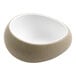 A white cheforward ramekin with a speckled surface.
