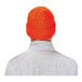 An orange Ergodyne knit winter hat with a white cuff.