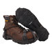 A pair of brown boots with a strap attached to metal traction devices.