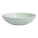 A white Cloud Terre by Fortessa bowl with a light blue rim.