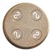 A circular metal Casarecce pasta die with white marks on it.