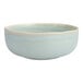 A close up of a Cloud Terre by Fortessa Collection light blue soup bowl.