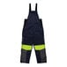 A pair of navy blue overalls with yellow accents and reflective stripes.