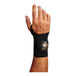 A man's right hand wearing a black Ergodyne ProFlex wrist brace.