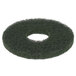 A white rectangular frame with a green Scrubble floor pad with a hole in the middle.