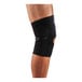 An Ergodyne ProFlex 615 knee compression sleeve with an open patella and anterior pad in black and white.