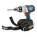 A cordless drill with an Ergodyne Squids large power tool trap attached to it.