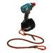 A black and blue Ergodyne Squids power tool trap attached to a cordless drill.