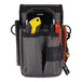 An Ergodyne Arsenal tool pouch with a tool and a pen in it.