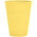 A yellow plastic cup on a white background.