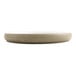 A white cheforward melamine plate with a white rim on a gray base.