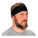 A man with a beard wearing a black Ergodyne Chill-Its evaporative cooling headband.