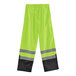 Ergodyne hi-vis lime green rain pants with black bottom and grey stripes.