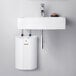 A white rectangular Stiebel Eltron mini tank water heater with red button.