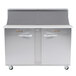 A large stainless steel Traulsen refrigerated sandwich prep table with 1 left hinged and 1 right hinged door.