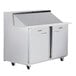 A stainless steel Traulsen refrigerator with left and right hinged doors.