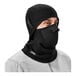 A person wearing a black Ergodyne fleece balaclava face mask.