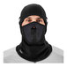 A man wearing a black Ergodyne N-Ferno fleece balaclava face mask.