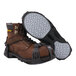 A pair of brown boots with metal straps attached to the soles.