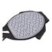 A grey and black circular Ergodyne TREX slip-resistant traction device with black handles.