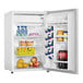 A white Danby reach-in refrigerator filled with drinks and fruit.