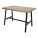 A BFM Seating Atlas black powder-coated steel A-frame table base on a wooden table with black legs.