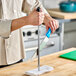 A person using a Choice stainless steel sharpening rod to sharpen a knife.