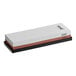 A white rectangular Schraf combination sharpening stone with black and brown surfaces.