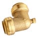 A gold colored brass SharkBite pipe fitting.