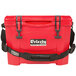 A red Grizzly Cooler with black handles.