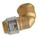 A SharkBite brass pipe fitting with a gold end.