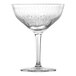 A clear Schott Zwiesel martini glass with a patterned stem.