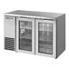 A stainless steel True back bar refrigerator with two glass doors.