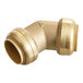 A SharkBite brass pipe fitting with a gold finish.