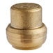 A SharkBite brass push-to-connect end cap with a gold circle on the top.