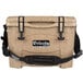 A Grizzly cooler box in sandstone with black straps and handles.