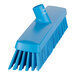 A close-up of a Vikan blue heavy-duty push broom head with soft/stiff bristles.