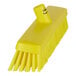 A yellow Vikan push broom head.