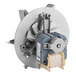 A small metal fan motor with a gear attached to it.