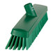 A green Vikan heavy-duty push broom head with soft/stiff bristles.