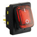 A red switch with a white circle and red light.