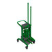 A Vikan HyGo mobile cleaning station with a green bucket and brush on it.