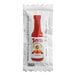 A white Tapatio hot sauce packet with a picture of a red bottle.