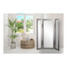 A BrandtWorks silver trifold dressing mirror in a room with a plant in a pot.