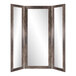 A BrandtWorks trifold dressing mirror with a wooden frame.