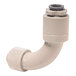 A white plastic pipe with a grey elbow.