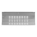 A close-up of a stainless steel front grille panel with holes.