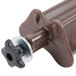 A close up of a brown plastic Carlisle Optimizer divider with a black knob.