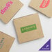 A group of Kraft cardboard pizza boxes with different logos.